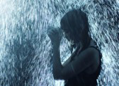 Girl praying in rain