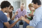 Group of five praying